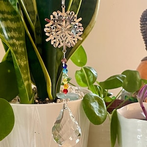 Suncatcher with snowflake and crystals design.